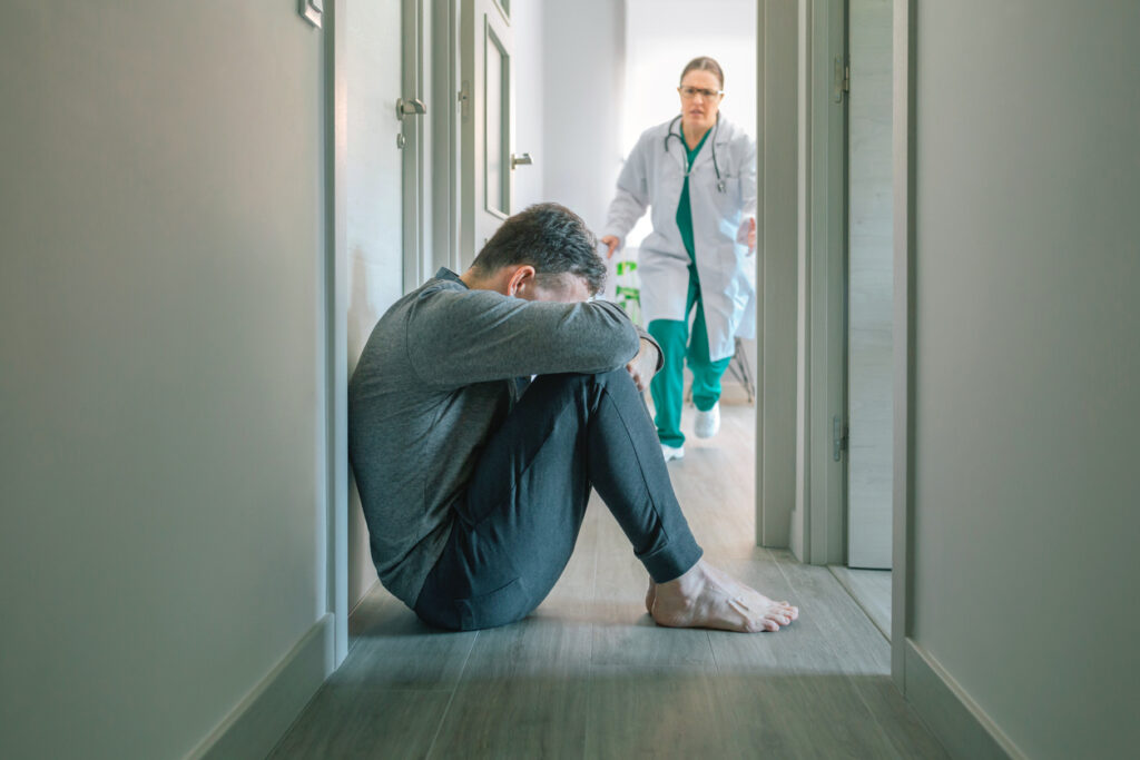 Female doctor running to help patient with mental disorder and suicidal thoughts crying
